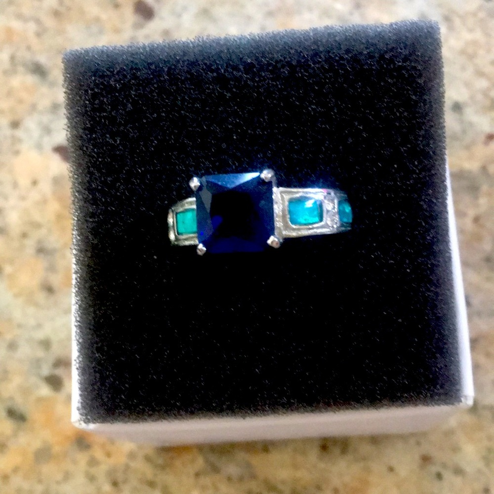 Marine Stone with cubic zirconia and light blue setting